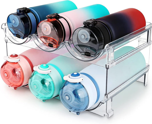 Colorful bottles with gradient designs on a clear stand against a white background